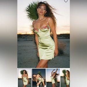 Green satin dress with floral embellishment